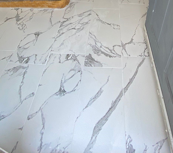 white, marble textured floor tiles